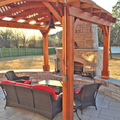 Arched Pergola Kit (Options: 12' L x 12' Arc W, California Redwood, No Electrical Wiring Trim, 4-Post Anchor Kit for Concrete, 1 Ceiling Fan Base, No Privacy Panels, No Curtain Rods, Transparent Premium Sealant, 2 Posts Wrapped in Masonry, 8 x 8 Posts by Custom Request). Photo Courtesy of S. Hunter of Fort Smith, AR.