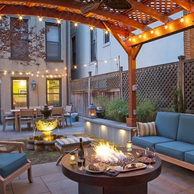 Arched Pergola Kits (Options: 14' L x 14' Arc W, Mature Redwood, 2 Electrical Wiring Trims, 4-Post Anchor Kit for Concrete, 1 Ceiling Fan Base, No Privacy Panels, No Curtain Rods, Transparent Premium Sealant). Photo Courtesy of Steve Walkowiak of Hoboken, NJ.