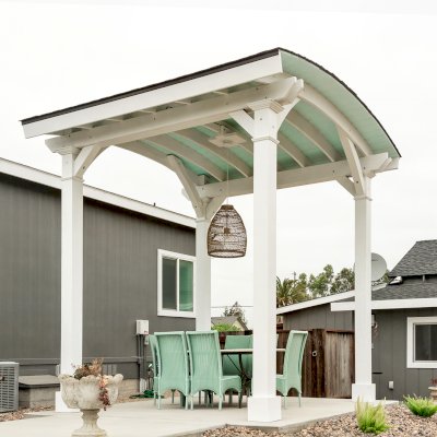  Arched Thick Timber Pavilion (Options: 12' L x 12' Arc W, Douglas-fir, 1 Electrical Wiring Trim, 4-Post Anchor Kit for Concrete, 1 Ceiling Fan Base, No Privacy Panel, No Curtain Rods, 12 ft H, Horizontal Decorative Trims on Posts, Custom Paint). Photo Courtesy of Siino Ventures of Kikrland, Washington.