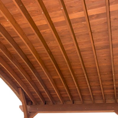 Custom Arched Thick Timber Pavilion (Options: 14' L x 20' Arc W, Mature Redwood, 1 Electrical Wiring Trim, 4-Post Anchor Kit for Concrete, No Ceiling Fan Base, No Privacy Panel, No Curtain Rods, 9 ft H, with 2x6's Roof Boards by Custom Request, Coffee-Stain Premium Sealant). Photo Courtesy of Siino Ventures of Kikrland, Washington.