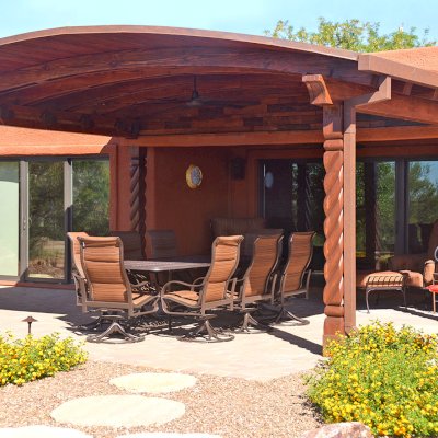 Custom Arched Thick Timber Pavilion (Options: 14' L x 18' Arc W, Douglas-fir, Attached, No Electrical Wiring Trim, No Posts, Pavilion Roof Installed on Existing Load Bearing Columns [Manufactured by https://southwestspiraldesigns.com], No Ceiling Fan Base, No Privacy Panel, No Curtain Rods, 10ft H, Coffee-Stain Premium Sealant). Photo Courtesy of R. Gatz of Green Valley, Arizona.