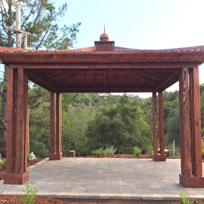 Asian Fusion Pavilion (Options: 18 ft L x 18 ft W, Douglas-fir, 4-Traditional Asian Fusion Anchoring Set, No Electrical Wiring Trim, 10 ft H, No Ceiling Fan, No Privacy Panels, No Curtain Rods, Coffee-Stain Premium Sealant). Photo Courtesy of M. Chadha of Saratoga, CA.