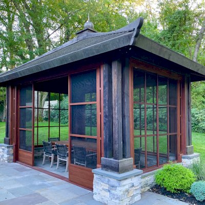 Asian Fusion Pavilion (Options: 22 ft L x 16 ft W, Mature Redwood, 4-Traditional Asian Fusion Anchoring Set, No Electrical Wiring Trim, 10 ft H, No Ceiling Fan, No Privacy Panels, No Curtain Rods, Coffee-Stain Sealant). Custom Screens Added: Customer called 5 years after original order was installed to add screens all around. You can see the different finish between the newly added screens and the original structure.