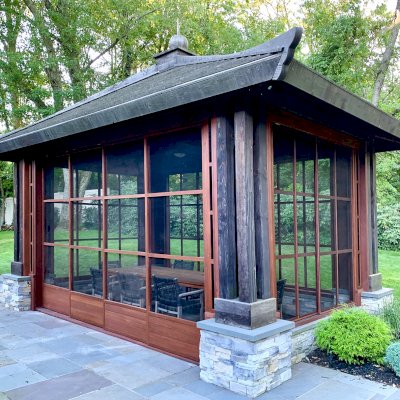Asian Fusion Pavilion (Options: 22 ft L x 16 ft W, Mature Redwood, 4-Traditional Asian Fusion Anchoring Set, No Electrical Wiring Trim, 10 ft H, No Ceiling Fan, No Privacy Panels, No Curtain Rods, Coffee-Stain Sealant). Custom Screens Added: Customer called 5 years after original order was installed to add screens all around. You can see the different finish between the newly added screens and the original structure.