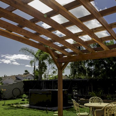 Attached Arched Pergola Kits (Options: 20' L x 15' W, California Redwood, No Electrical Wiring Trim, Arched Roof without Lattice Panels, 2-Post Anchor Kit for Concrete, No Ceiling Fan Base, No Privacy Panels, No Curtain Rods, 10' Post Height, Transparent Premium Sealant). Photo Courtesy of C. Thompson of Corona, CA.