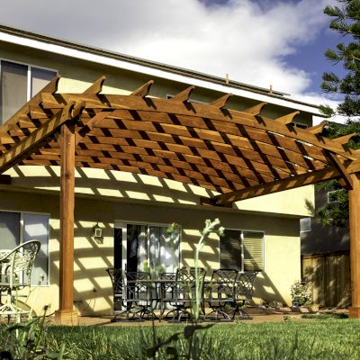 Attached Arched Pergola Kits (Options: 20' L x 15' W, California Redwood, No Electrical Wiring Trim, Arched Roof without Lattice Panels, 2-Post Anchor Kit for Concrete, No Ceiling Fan Base, No Privacy Panels, No Curtain Rods, 10' Post Height, Transparent Premium Sealant). Photo Courtesy of C. Thompson of Corona, CA.