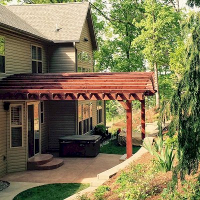 Attached Arched Pergola Kits (Options: 20' L x 26' W, Douglas-fir, No Electrical Wiring Trim, Rafters at 18" and Slats at 18", Widthwise Roof Support Timbers, 2-Post Anchor Kit for Concrete, Ceiling Fan Base, No Privacy Panels, No Curtain Rods, 11' Post Height, Coffee-Stain Premium Sealant). Photo Courtesy of Susanne Stephens of Eureka, Missouri.