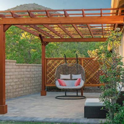 Attached Garden Perglola (Options: 12'-6" x 16', California Redwood, Open Roof with Slats at 18", Rafters at 18", Attached to the Wall by Rafter Side, 2-Post Anchor Kit for Concrete, 1 Lattice Privacy Panel, No Ceiling Fan Base, Transparent Premium Sealant). Photo Courtesy of S. Abbasi of Newbury Park, CA.