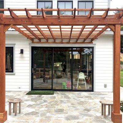 Attached Garden Pergola (Options: 14' x 13', California Redwood, Open Roof with Slats at 18", Rafters at 18", 2-Post Anchor Kit for Concrete, No Ceiling Fan Base, Transparent Premium Sealant). Photo Courtesy of B. Tewksbury of Mill Valley, California.
