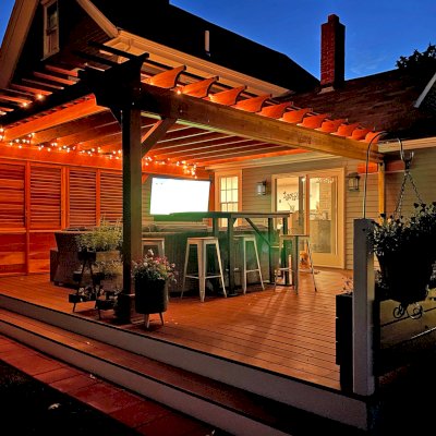 Attached Garden Pergolas (Options: 20' L x 17'-6" W, Attached to Wall by Rafter Side, California Redwood, No Electrical Wiring Trim, No Ceiling Fan Base, Open Roof with Slats at 12", No Rain Guard, 3-Post Anchor Kit for Wood, with Two 6x6 Posts and One 4x4 Post,  with 3x8 Extra Posts Against Wall by Custom Request, Transparent Premium Sealant). Photo Courtesy of I. Clarkson of Abington, Massachusetts.