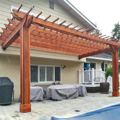 Attached Garden Pergolas (Options: 20' L x 10' W, Mature Redwood, No Electrical Wiring Trim, 2-Post Anchor Kit for High-Wind, Open Roof with Slats at 12", Rafters at 18", Vertical post decorative trim, Transparent Premium Sealant). Photo Courtesy of D. Abrams of San Jose, California.