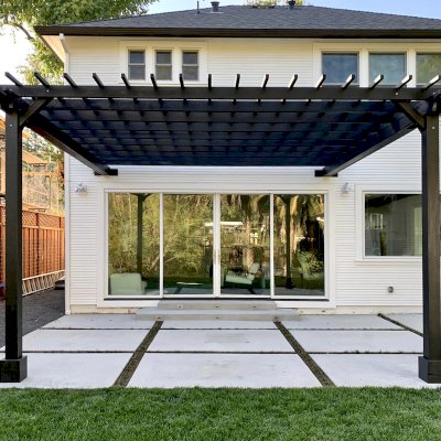 Attached Garden Pergola (Options: 18' x 16', California Redwood, Open Roof with Slats at 12", Rafters at 18", 2-Post Anchor Kit for Concrete, No Ceiling Fan Base, Black Stain Premium Sealant). Photo Courtesy of D. Murphy of San Anselmo, CA.