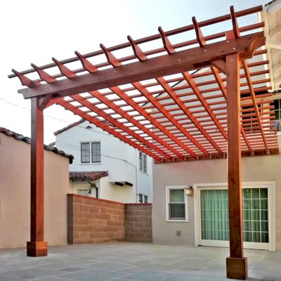 Attached Garden Pergola (Options: 13'-6" x 16'-6", Mature Redwood, Open Roof with Slats at 6", Rafters at 18", 2-Post Anchor Kit for Concrete, No Ceiling Fan Base, Transparent Premium Sealant). Photo Courtesy of J. Mason of Alameda, California.