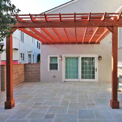 Attached Garden Pergola (Options: 13'-6" x 16'-6", Mature Redwood, Open Roof with Slats at 6", Rafters at 18", 2-Post Anchor Kit for Concrete, No Ceiling Fan Base, Transparent Premium Sealant). Photo Courtesy of J. Mason of Alameda, California.