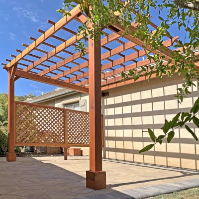 Attached Garden Perglola (Options: 12'-6" x 16', California Redwood, Open Roof with Slats at 18", Rafters at 18", Attached to the Wall by Rafter Side, 2-Post Anchor Kit for Concrete, 1 Lattice Privacy Panel, No Ceiling Fan Base, Transparent Premium Sealant). Photo Courtesy of S. Abbasi of Newbury Park, CA.