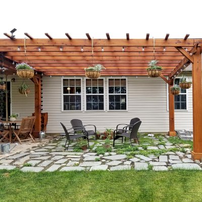 Attached Garden Pergolas (Options: 18' L x 14' W, California Redwood, No Electrical Wiring Trim, 2-Post Anchor Kit for High-Wind, Open Roof with Slats at 18", Rafters at 18", No Post Decorative Trims, Transparent Premium Sealant). Pergola Attached to a Del Norte Pavilion. Photo Courtesy of T. Lee of Noblesville, Indiana.
