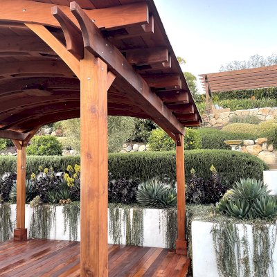 Backyard Pavilion Kit (Options: 14' L x 14-6" Arc W, Mature Redwood, 4-Post Anchor Kit for High-Wind, 1 Ceiling Fan Base, No Privacy Panels, No Electrical Wiring Trim Kit, 9.5 ft Post Height, Transparent Premium Sealant) with Deck in Mature Redwood to Match Pavilion. Copper roofing installed by custom request. Photo Courtesy of D. Goldfarb of Santa Barbara, CA.