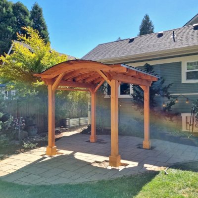 Backyard Pavilion Kits (Options: 10' x 10', Douglas-fir, Electrical Wiring Trim Kit for 1 Post, 4-Post Anchor Kit for High-Wind, No Ceiling Fan Base, No Privacy Panels, 1 Curtain Rod, 8 ft Post Height, Transparent Premium Sealant). Photo Courtesy of M. Olson of Newberg, OR.
