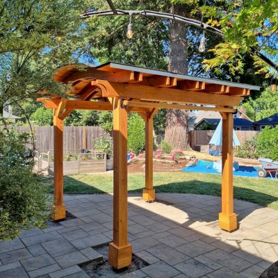Backyard Pavilion Kits (Options: 10' x 10', Douglas-fir, Electrical Wiring Trim Kit for 1 Post, 4-Post Anchor Kit for High-Wind, No Ceiling Fan Base, No Privacy Panels, 1 Curtain Rod, 8 ft Post Height, Transparent Premium Sealant). Photo Courtesy of M. Olson of Newberg, OR.