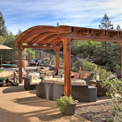Backyard Pavilion Kits (Options: 12' L x 22' Arc W, California Redwood, No Electrical Wiring Trim, 4-Post Anchor Kit for High-Wind, No Ceiling Fan Base, No Privacy Panels, No Curtain Rods, 9.5 ft Post Height, Transparent Premium Sealant). Photo Courtesy of S. Bell of Santa Rosa, CA.