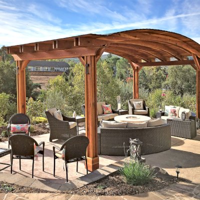 Backyard Pavilion Kits (Options: 12' L x 22' Arc W, California Redwood, No Electrical Wiring Trim, 4-Post Anchor Kit for High-Wind, No Ceiling Fan Base, No Privacy Panels, No Curtain Rods, 9.5 ft Post Height, Transparent Premium Sealant). Photo Courtesy of S. Bell of Santa Rosa, CA.