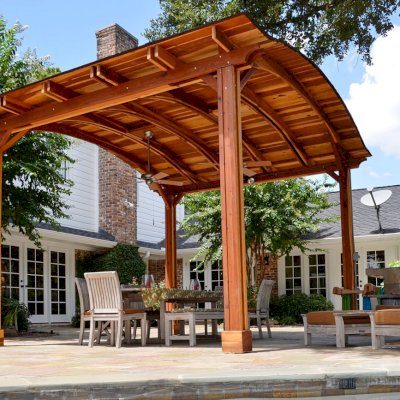 Backyard Pavilion Kits (Options: 14' L x 16' Arc W, California Redwood, 1 Post Electrical Wiring Trim, 4-Post Anchor Kit for Concrete, Add 2 Ceiling Fan Bases, No Privacy Panels, No Curtain Rods, 10 ft Post Height, Transparent Premium Sealant). Photo Courtesy of John E. Ligums of Houston, Texas.