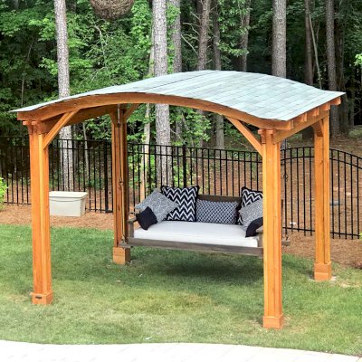 Backyard Pavilion Kits (Options: 12' L x 10' Arc W, Douglas-fir, No Electrical Wiring Trim, 4-Post Anchor Kit for High-Wind, No Ceiling Fan Base, No Privacy Panels, No Curtain Rods, 9 ft Post Height, Transparent Premium Sealant). Swing added by customer. Photo Courtesy of E. Schechtman of Wake Forest, NC.