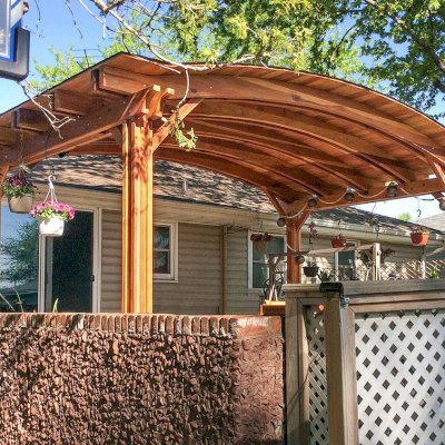 Backyard Pavilion Kits (Options: 20' x 12', California Redwood, No Electrical Wiring Trim Kit, 4-Post Anchor Kit for Stone, No Ceiling Fan Base, No Privacy Panels, No Curtain Rods, 10 ft Post Height, Transparent Premium Sealant). Photo Courtesy of Gary C. of Blaine, Minnesota.