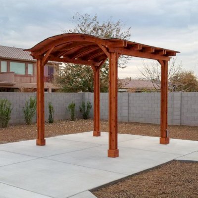 Backyard Pavilion Kits (Options: 12' x 12', Mature Redwood, Electrical Wiring Trim Kit for 2 Posts, 4-Post Anchor Kit for Stone, Add Ceiling Fan Base, No Privacy Panels, No Curtain Rods, 10 ft Post Height, Transparent Premium Sealant). Photo Courtesy of Connie Josephson of Laveen, Arizona.