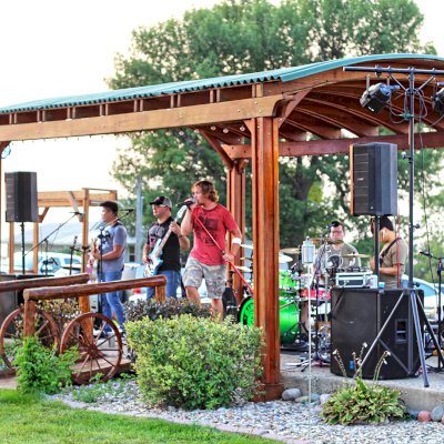Backyard Pavilion Kits (Options: 20' x 12'-6", California Redwood, No Electrical Wiring Trim Kit, 4-Post Anchor Kit for Concrete, 1 Ceiling Fan Base, No Privacy Panels, No Curtain Rods, 10 ft Post Height, Transparent Premium Sealant). Photo Courtesy of Jody & Bob Purdie of Mitchellville, Iowa.