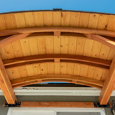 Backyard Porch Pavilion (Options: 8 'L x 10' W, Douglas-fir, 2-Post Anchor Kit for Concrete, No Electrical Wiring Trim, 8 ft Post Height, No Ceiling Fan Base, No Curtain Rods, No Privacy Panels, Transparent Premium Sealant). Photo Courtesy J. Clark of San Diego, CA.