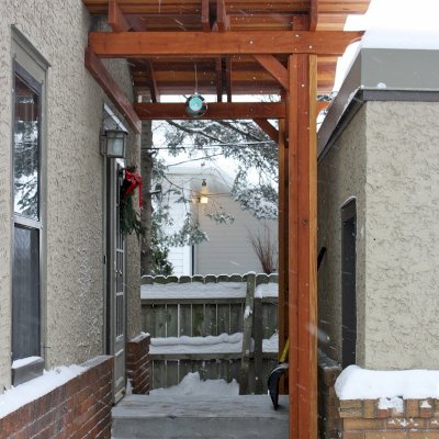 Backyard Porch Pavilion (Options: 6'L x 10'W, California Redwood, 2-Post Anchor Kit for Concrete, No Electrical Wiring Trim, 10ft Post Height, No Ceiling Fan Base, No Curtain Rods, No Privacy Panels, Transparent Premium Sealant). Photo Courtesy of John E. of Maplewood, Minnesota.