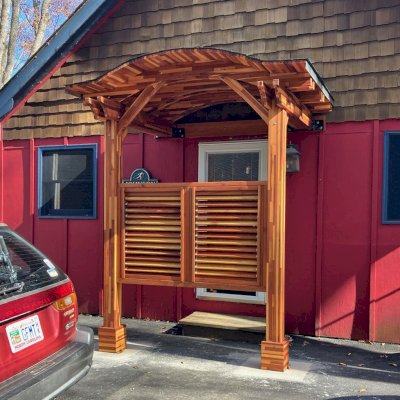 Custom Backyard Porch Pavilion (Options: 6 'L x 8' W, Mosaic Redwood, 2-Post Anchor Kit for High Wind, 2 Electrical Wiring Trims, 9 ft Post Height, No Ceiling Fan Base, No Curtain Rods, with Fixed Half Height Panel, Transparent Premium Sealant). Photo Courtesy C. Johnson of Banner Elk, NC.