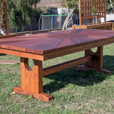 Custom Design (Options: 8' L x 46" W, California Redwood [Central Section in Old-Growth Redwood], Squared Corners, with Umbrella Hole, Custom Tabletop). Photo Also Shows 2 Custom Planters with Trellis on Background.