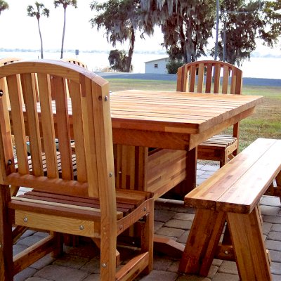 Baja Outdoor Redwood Dining Table (Options: 6 ft L, 42 inches W, Chairs and a Picnic Bench on One Side, Mosaic Redwood, Standard Tabletop, Slightly Rounded Corners, No Umbrella Hole, Transparent Premium Sealant). Customer ordered bench on one side with chairs for other sides. If you would like a custom seating arrangement you don't see on our site, just let us know. Photo Courtesy of B. Woods of Mount Dora, FL.