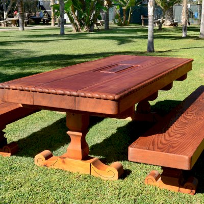 Custom Design (Options: 8' L x 3'-5" W, Old-Growth Redwood, 1/2" Corner Rounding, Custom Engraving). Made with 6 x 14 vertical grain timbers for the tabletop and a lot of custom carving!
