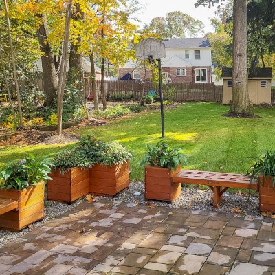 Bench and Planters Combo (Options: 5 ft Bench Length, 20" L x 20" D x 24" H Planter Size, Douglas-fir, Lighthouse Bench Style, 18 1/2 inches Bench Height, 19 1/2 inches Bench Width, Custom Engraving, Mendocino Planter Style, With Feet, No Growing Vegetables, Transparent Premium Sealant). Photo Also Shows a 42" L x 20" W x 24" H Forever Corner Planter. Photo Courtesy of S. Korapati of East Brunswick, NJ.