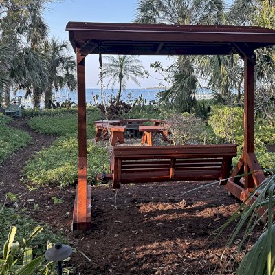 Bench Swing Set (Options: Large Bench, Swing Roof, Mature Redwood, Ensenada Style Seat, No Engraving, Transparent Premium Sealant). Photo Courtesy of D. Weinkle of Bradenton, FL.