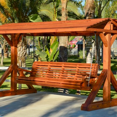 Custom Bench Swing Sets (Options: Custom Bench Size, Include Swing Roof, California Redwood, Ensenada Style Seat, No Engraving, Transparent Premium Sealant). Thicker design by custom request. Roof size is 12' x 7', bench is 9' total length, with 5 1/2" x 5 1/2" posts.