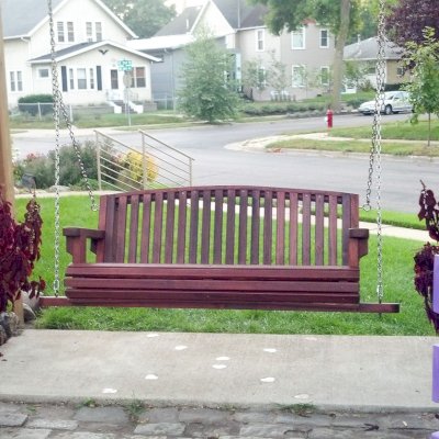 Bench Swings (Seats Only) (Options: Large Garden Bench, Old-Growth Redwood, Luna Backrest Seat, No Engraving, All Beam Hanging Hardware, Cherry Stain Premium Sealant). Photo Courtesy of Robert MacDonald of Minneapolis, Minnesota. 