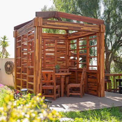 Catalina Island Pergola (Options: 8' x 8', Mosaic Redwood, 8' Post Height, Transparent Premium Sealant). Photo Also Shows a Round Patio Table with Segovia Chairs.