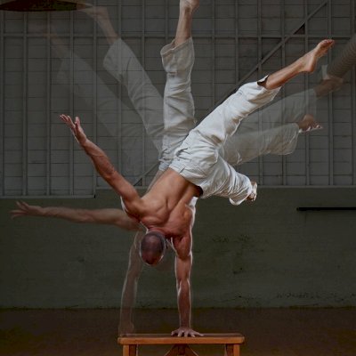San Francisco Yoga Master Reed Taylor using a custom sized Classic Wooden Picnic Bench for exercising. (Options: 1 ft 8in Length, 17 1/2 in Heigth, California Redwood, Rounded Corner, Custom Engraving, Transparent Premium Sealant).