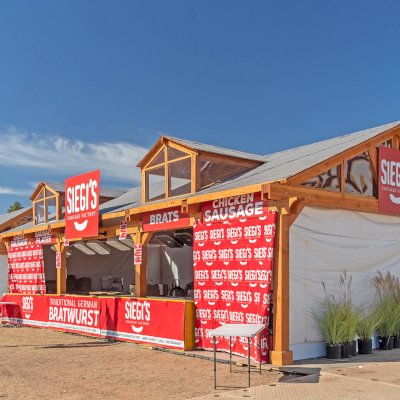 Custom Wood Pavilion Kit (Options: 30 ft L x 20 ft W, Douglas-fir, Transparent Premium Sealant). After installation prior to roofing being added. Polycarbonate enclosure added by custom request. Photo Courtesy of Tulsa, Oklahoma Oktoberfest Team.