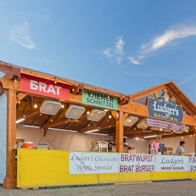 Custom Wood Pavilion Kit (Options: 43 ft L x 23 ft W, Douglas-fir, Transparent Premium Sealant). After installation prior to roofing being added. Polycarbonate enclosure added by custom request. Photo Courtesy of Tulsa, Oklahoma Oktoberfest Team.