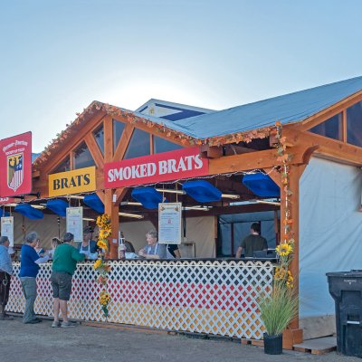 Custom Wood Pavilion Kit (Options: 43 ft L x 23 ft W, Douglas-fir, Transparent Premium Sealant). After installation prior to roofing being added. Polycarbonate enclosure added by custom request. Photo Courtesy of Tulsa, Oklahoma Oktoberfest Team.