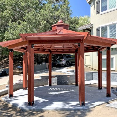 Custom Wood Pavilion Kits (Options: 20' Diameter, Mature Redwood, with a Ceiling Fan Base, with Louvers and Rain Guard, Post Anchor Kit for High-Wind, Transparent Premium Sealant).