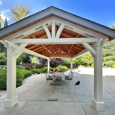 Custom Wood Pavilion (Options: 20 ft L x 12 ft W, Douglas-fir, 9.5 ft H Posts, Hip Roof Framing on One End, Like Loreto Pavilion, 1 Ceiling Fan Base, Custom Finish [White Exterior and Transparent Premium Sealant Interior Ceiling/Roof Framing]). Photo Courtesy of D. Bishop of  Livermore, CA.