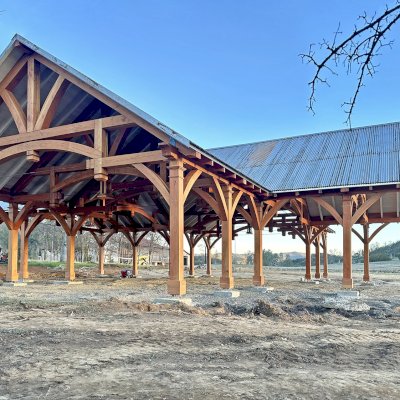 Custom Wood Pavilion (Options: 74' x 74', Douglas-fir, 20-Post Anchor Kit for High-Wind, 10' H Posts, Horizontal Decorative Trims for All Posts, with 5 Ceiling Fan Bases, Transparent Premium Sealant, White Wash for Ceiling). Photo Courtesy of J. Fookes of Elk Creek, CA.