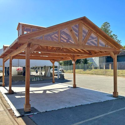 Custom Wood Pavilion Kit (Options: 30 ft L x 20 ft W, Douglas-fir, Transparent Premium Sealant). After installation prior to roofing being added. Polycarbonate enclosure added by custom request. Photo Courtesy of Tulsa, Oklahoma Oktoberfest Team.