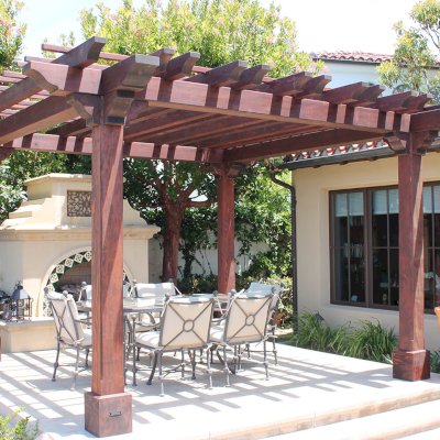Custom Wooden Fat Timber Pergola (Options: 15' L x 15' W, Old Growth Redwood, Include Wiring Trim for 1 Post, Open Roof with Slats at 18" Rafters at 18" Roof Support Timbers, 4-Post Anchor Kit for Concrete, No Ceiling Fan Base, No Privacy Panels, No Curtain Rods, 11ft 6in Post Height square to outside corners, Include enough overhang to go to full 15 ft square roof size., Coffee-Stain Premium Sealant). Photo Courtesy of Bruce K. of Newport Coast, CA.